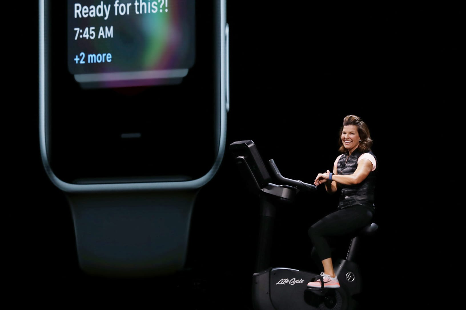 Julz Arney hops on a stationary bike to demonstrate new watchOS 5 capabilities